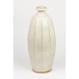 Jack Kenny (Contemporary), A stoneware vase of ribbed baluster form, wood fired with ash glaze,