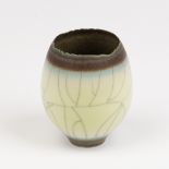 David White (1934-2011), a celadon crackle glaze porcelain vessel of bud form with irregular rim,