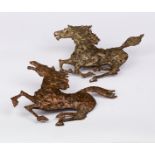 A pair of metalwork galloping horses, 1960s, approximately 26cm wide/Provenance: Kelso blacksmith,