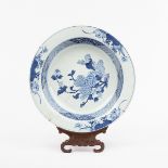 An 18th Century Kangxi blue and white bowl decorated three chrysanthemums amongst other flowering