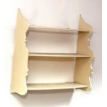 A set of white painted open shelves with shaped ends, 61.