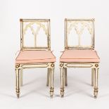 A pair of Regency white and gilt painted single chairs of Gothic design CONDITION REPORT: