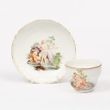 An ogee cup and saucer, circa 1780, decorated at the Hague with scenes of Venus and Cupid,