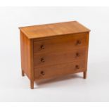 Gordon Russell Workshops/A walnut chest, 1950s, fitted three long drawers with turned handles,