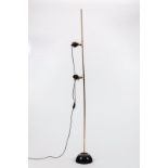 Harvey Guzzini/A two-light floor lamp, Italian 1950s, weighted black dome base and metal stem,