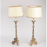 A pair of Carolean style silvered altar type candlesticks on tripod supports, complete with shades,