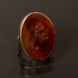A carnelian intaglio ring depicting Apollo, a lyre at his neck,