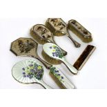 A silver and mother-of-pearl backed dressing table set, Birmingham 1926, with chinoiserie decoration