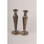 A pair of silver candlesticks, Birmingham 1926, of octagonal baluster form, 28cm high, weighted