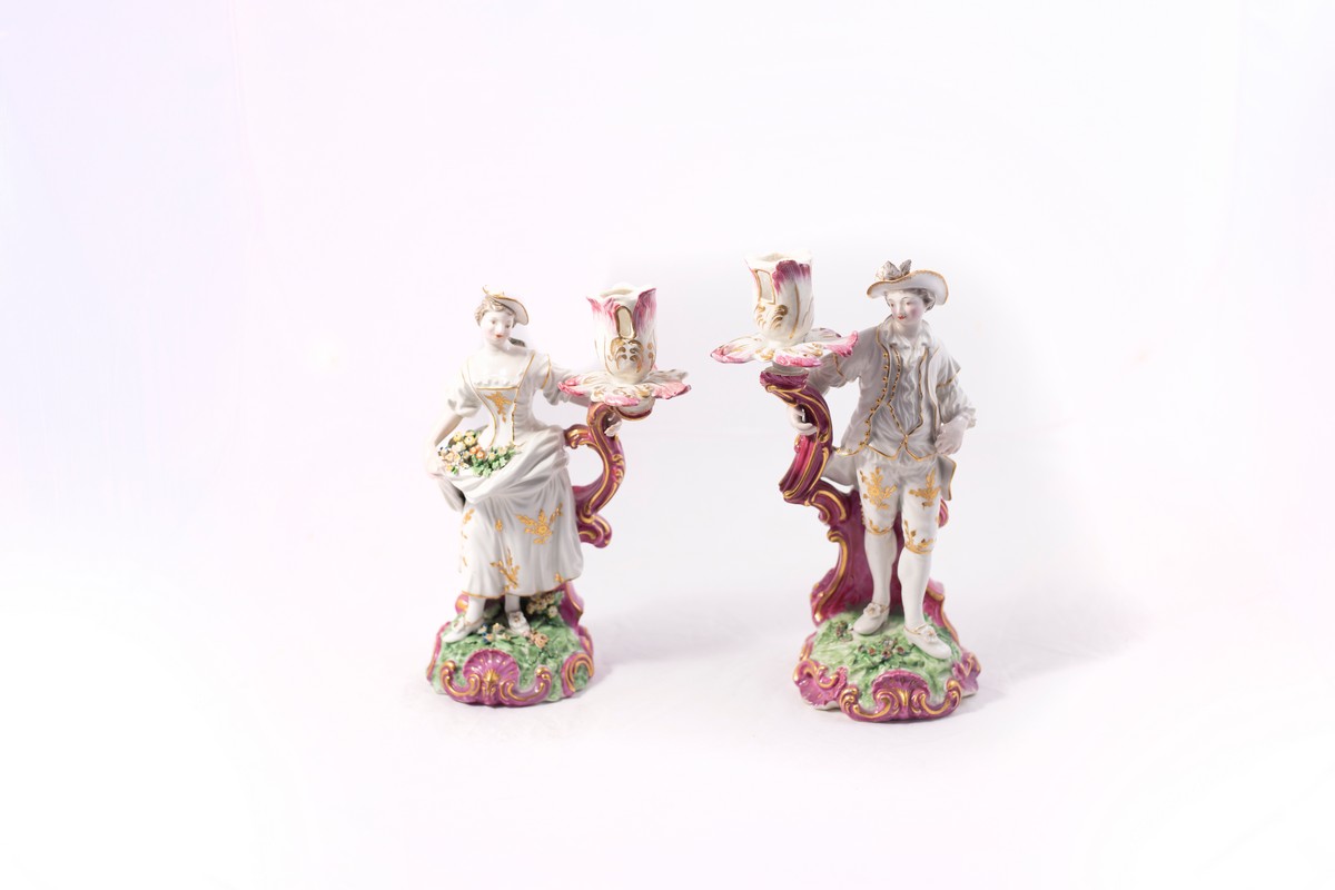 A pair of Derby figural candlesticks, circa 1780, modelled as a lady and gallant,