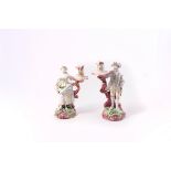 A pair of Derby figural candlesticks, circa 1780, modelled as a lady and gallant,