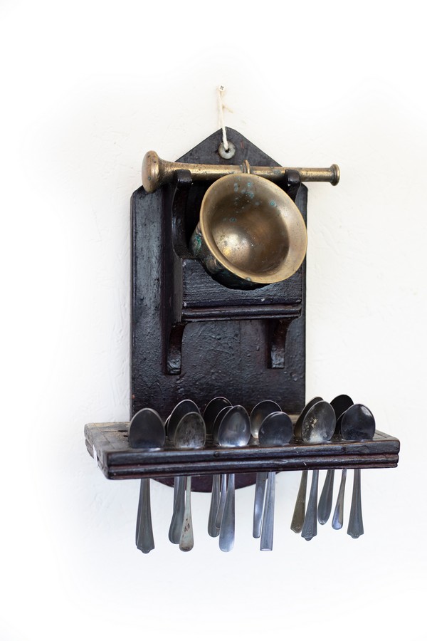 A mortar, pestle and spoon rack,