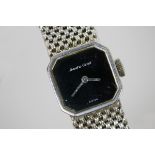 A lady's Bueche Girod wristwatch, with canted square black dial to a 9ct white gold bracelet,