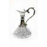 A silver mounted cut glass claret jug, Birmingham 1984, with S-scroll handle,