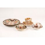 A pair of Coalport Imari pattern plates, circa 1810, together with a similar coffee can and saucer,