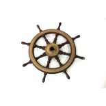 A brass mounted ship's wheel,