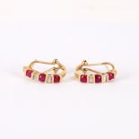 A pair of ruby and diamond half hoop earrings, set in 10k yellow gold,