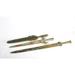 Three Chinese bronze swords and one scabbard CONDITION REPORT: Longest- 96cm long