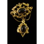 A Victorian style 9ct gold and garnet pendant/brooch,