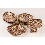 A Royal Crown Derby part dessert service, pattern 8706, comprising eight plates, two oval dishes,