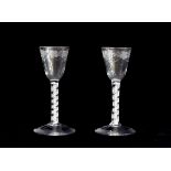 A pair of 18th Century engraved air twist wine glasses, 14.