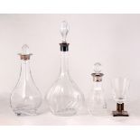 Three silver mounted decanters, various, one with associated stopper, the tallest 38cm high and a