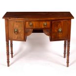 A Victorian mahogany bowfront kneehole sideboard, fitted a surround of three drawers on turned legs,