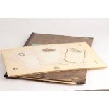 A scrap book containing a collection of French embossed letterheads and various scraps,