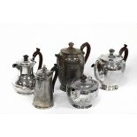 A silver coffee pot and teapot, Birmingham 1928, two coffee pots and a teapot (lacking handle),