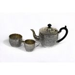 A Victorian three-piece silver tea set, Nathan & Haynes, Birmingham 1890/92, in the Persian style,