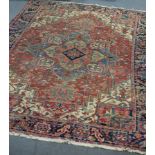 A Heriz carpet, North West Persia, with central medallion within a stylised foliate border,