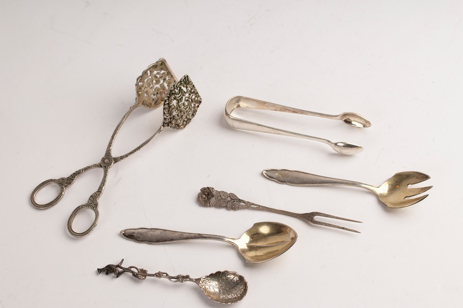 A small quantity of Continental silver including 800 standard spoon and fork, tongs, sugar nips etc.