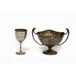 A silver trophy cup, HF & Co., Birmingham 1911, with twin handles and wavy rim, inscription relating