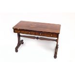 A Regency rosewood library table fitted two drawers on shaped end standards,