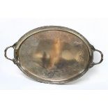 An oval silver tray, Elkington & Co., Birmingham 1935, with scroll handles and engraved