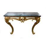 A 19th Century marble topped console table on scroll carved legs and frieze,