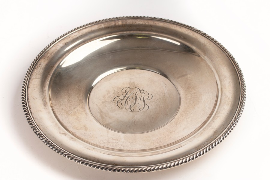 An American sterling silver charger, Gorham, impressed number 447, with central scrolling initials