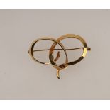 An 18ct gold brooch, London 2000, of entwined ribbon form, 5cm long, approximately 11.