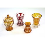 A Bohemian red flash beaker decorated named buildings,