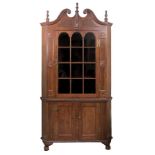 An American cherrywood standing corner cupboard, circa 1800,