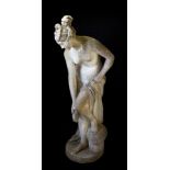 A reconstituted stone figure of a female bather,