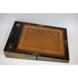 A coromandel lap desk with leather lined writing slope, pen tray and other compartments,