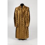 A button-through coat in a bronze paisley design fabric,