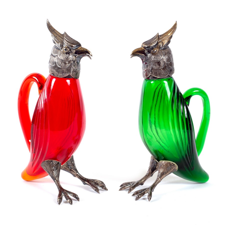 A pair of novelty oil and vinegar bottles of long crested eagle form, mounted in Spanish .