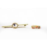 A coral and diamond half-hoop ring in 18ct yellow gold,