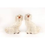 A pair of white glazed Staffordshire dogs,