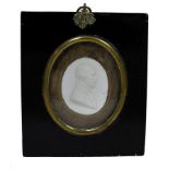 An oval cameo portrait of Nelson in ebonised frame, 5.5cm x 4.