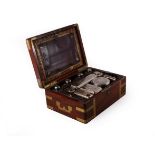 A George IV gentleman's dressing case, the silver mounted bottles,