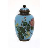 A Japanese cloisonné jar and cover, decorated chrysanthemums and butterflies,