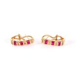 A pair of ruby and diamond half hoop earrings, set in 14k yellow gold, maker RJM,
